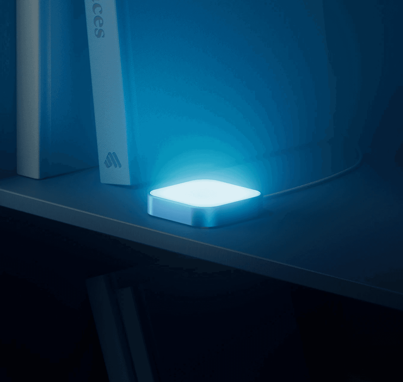 Luma glowing on a dark shelf