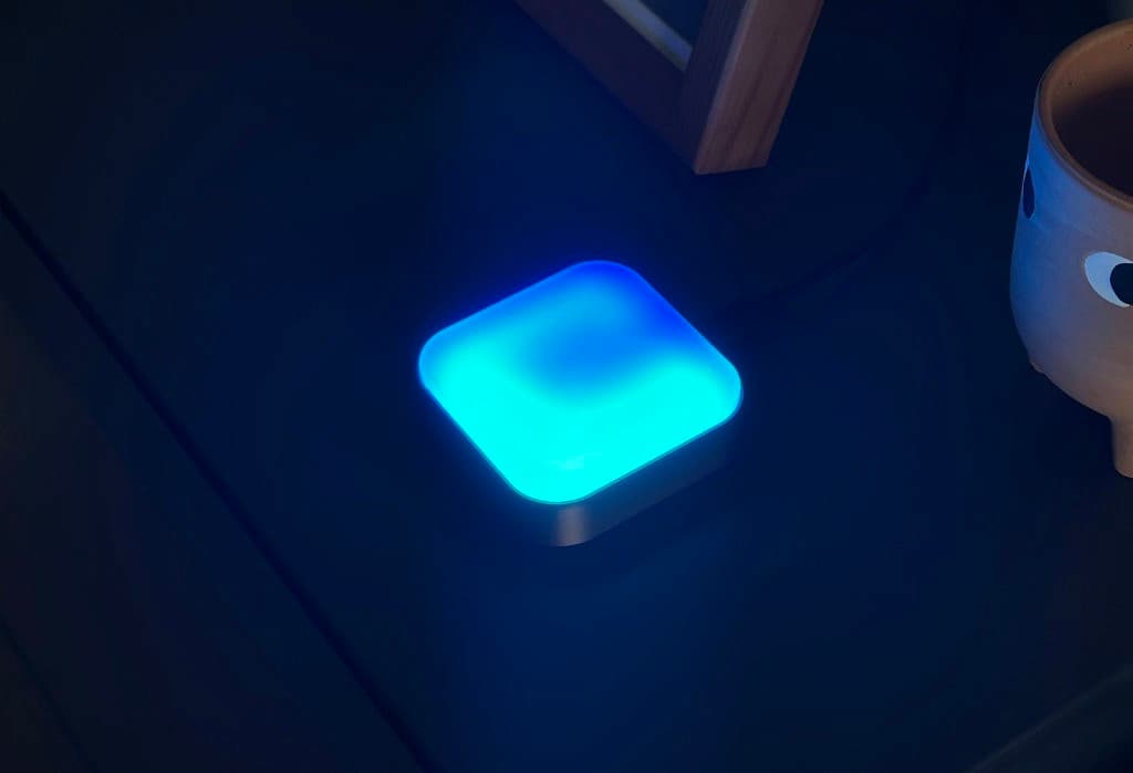 Luma glowing cyan in a dark room