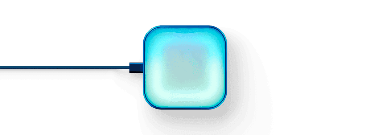Luma glowing cyan, connected by a USB-C cable